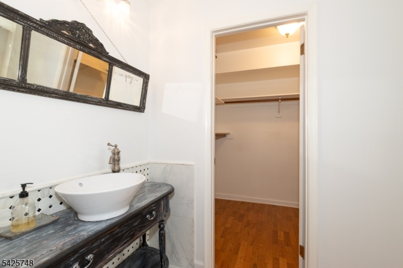 10 Crestmont Road Bedminster, NJ 07921 - Photo 24 of 41 a bathroom with a sink and a mirror