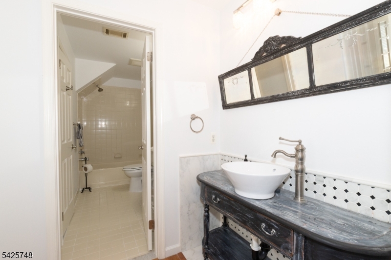 10 Crestmont Road Bedminster, NJ 07921 - Photo 25 of 41 a bathroom with a sink and a mirror