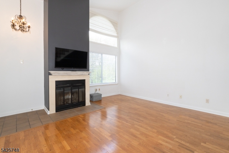 10 Crestmont Road Bedminster, NJ 07921 - Photo 6 of 41 a view of empty room with a fireplace