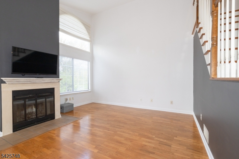 10 Crestmont Road Bedminster, NJ 07921 - Photo 7 of 41 a view of empty room with a fireplace and a window