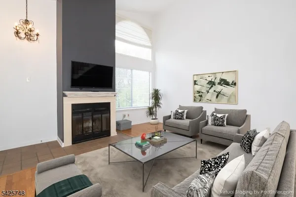 a view of empty room with a fireplace
