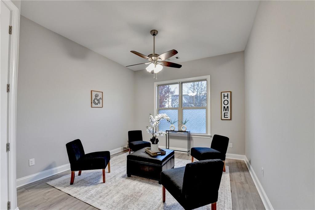 3907 Rustic Pine Lane Buford, GA 30518 - Photo 29 of 70 a living room with furniture and a window