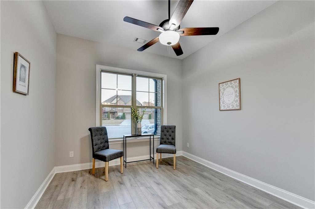 3907 Rustic Pine Lane Buford, GA 30518 - Photo 32 of 70 a workspace with wooden floor and a window