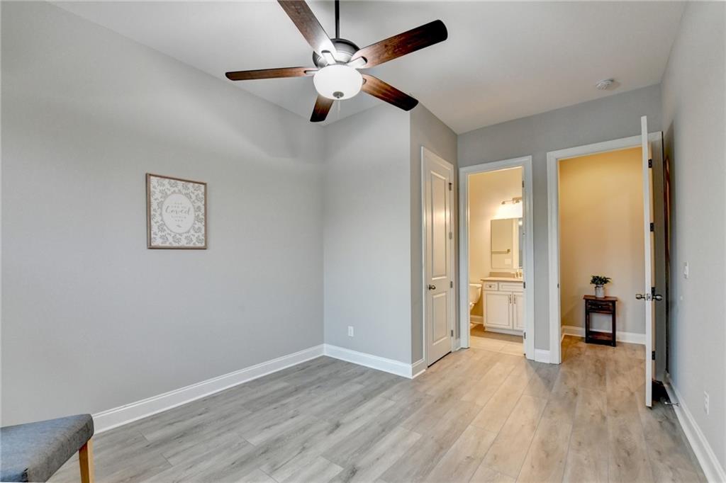 3907 Rustic Pine Lane Buford, GA 30518 - Photo 33 of 70 wooden floor in an empty room with a window