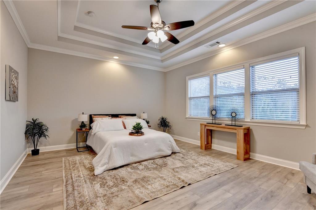 3907 Rustic Pine Lane Buford, GA 30518 - Photo 35 of 70 a bedroom with a bed and a desk