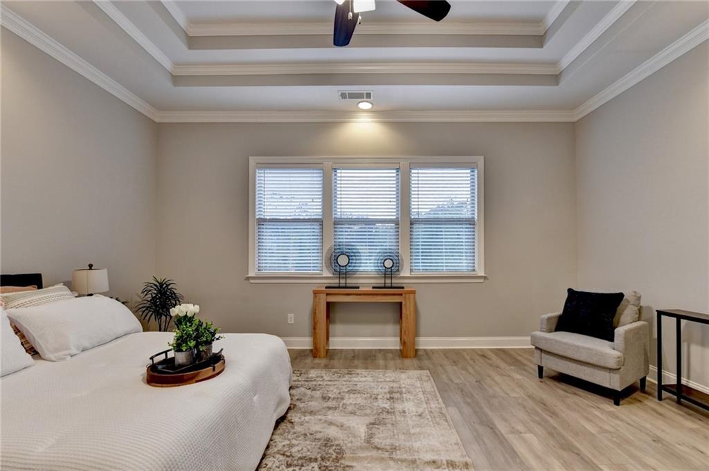 3907 Rustic Pine Lane Buford, GA 30518 - Photo 36 of 70 a living room with furniture and a potted plant