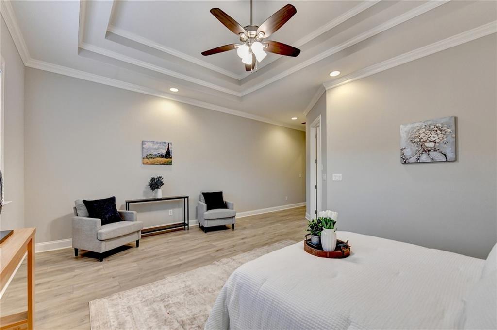 3907 Rustic Pine Lane Buford, GA 30518 - Photo 38 of 70 a bedroom with a bed and a couch