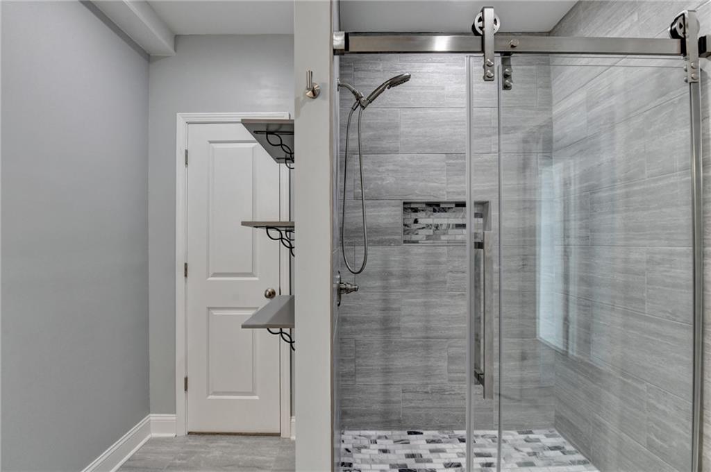 3907 Rustic Pine Lane Buford, GA 30518 - Photo 59 of 70 a bathroom with a shower