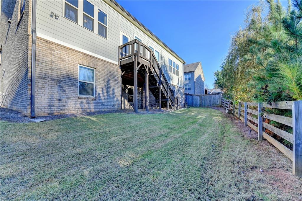 3907 Rustic Pine Lane Buford, GA 30518 - Photo 64 of 70 a view of a house with a yard