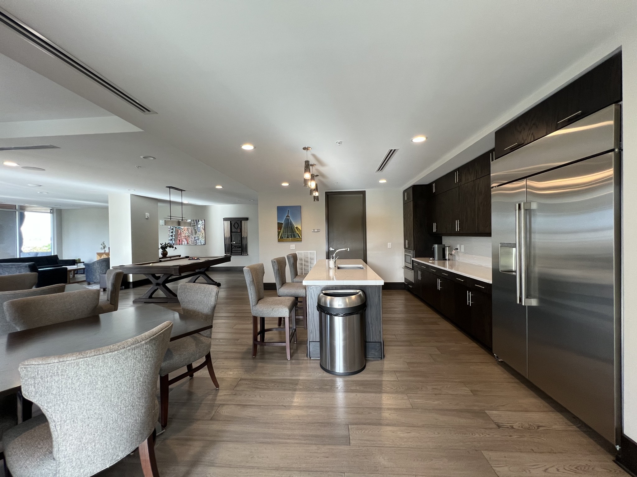 20 Rutledge Street, Unit 704 Nashville, TN 37210 - Photo 12 of 40 a large kitchen with a table and chairs