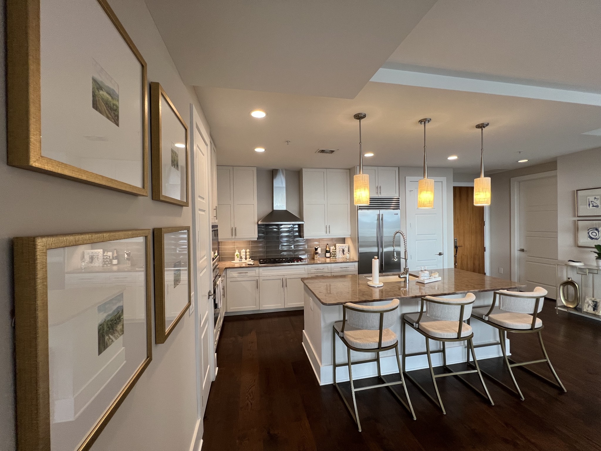 20 Rutledge Street, Unit 704 Nashville, TN 37210 - Photo 28 of 40 a large kitchen with a table and chairs