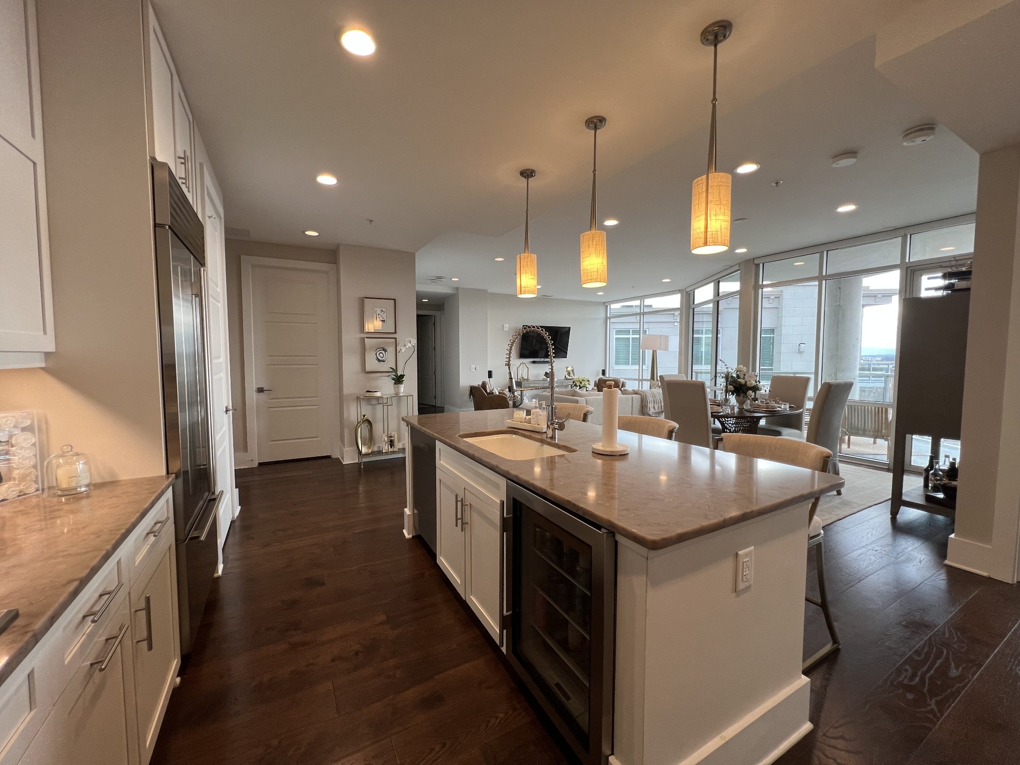 20 Rutledge Street, Unit 704 Nashville, TN 37210 - Photo 30 of 40 a kitchen with stainless steel appliances granite countertop a sink a stove and a wooden floors