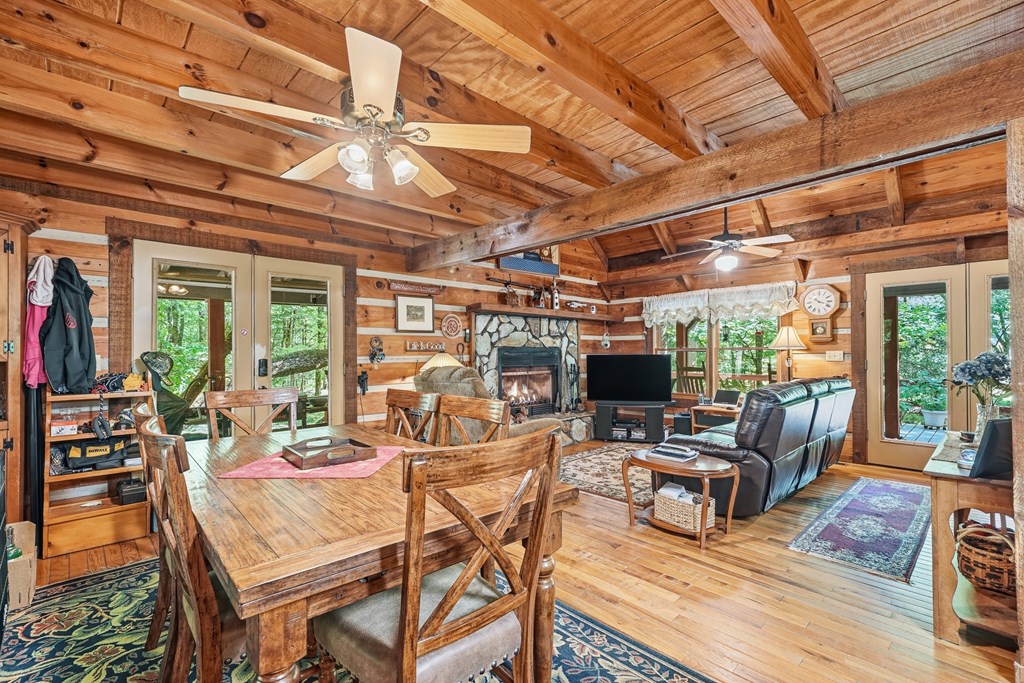 86 Tipton Court Cherry Log, GA 30522 - Photo 14 of 81 a view of a patio with dining table and chairs with wooden floor