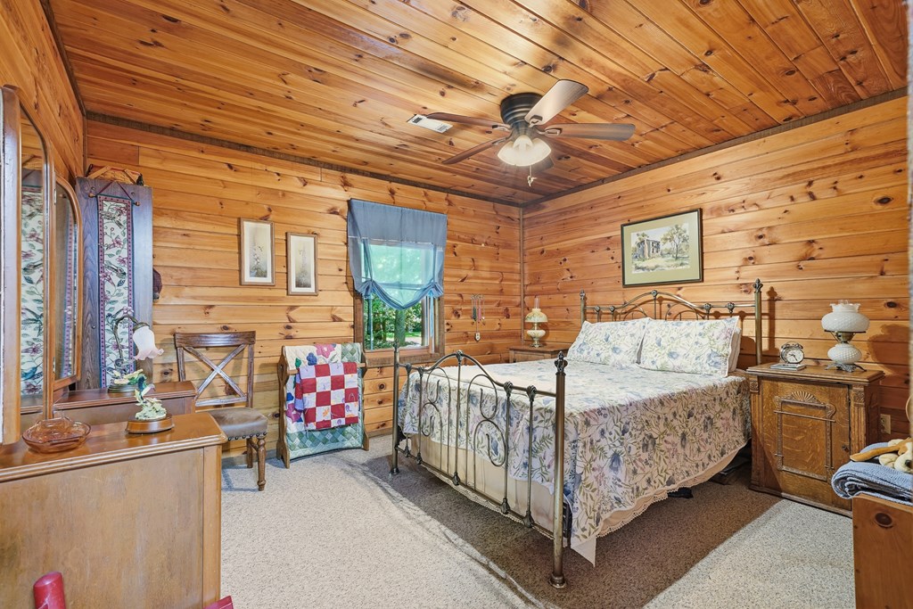 86 Tipton Court Cherry Log, GA 30522 - Photo 16 of 81 a bed sitting in a bedroom next to a window