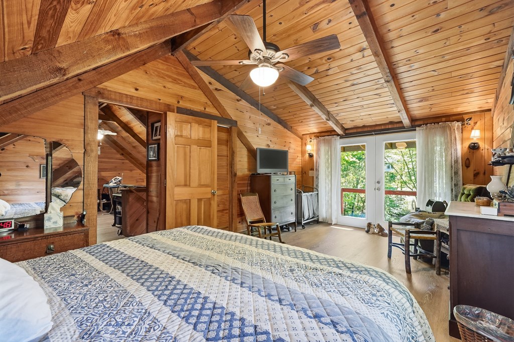 86 Tipton Court Cherry Log, GA 30522 - Photo 57 of 81 a bed room with a bed and a large mirror
