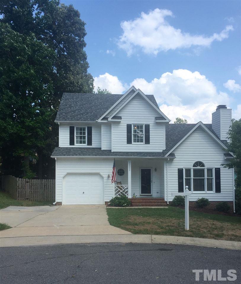 12220 Jarden Court Raleigh, NC 27613 - Photo 1 of 17 a front view of a house with a garden