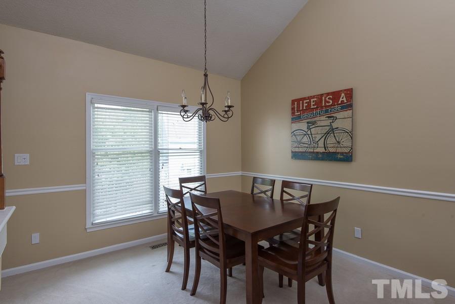 12220 Jarden Court Raleigh, NC 27613 - Photo 5 of 17 a view of a dining room with furniture window and wooden floor