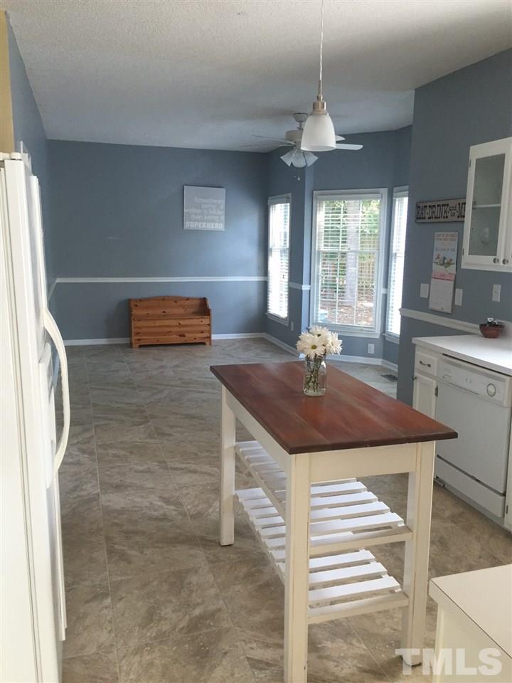 12220 Jarden Court Raleigh, NC 27613 - Photo 6 of 17 a kitchen with stainless steel appliances granite countertop a sink and a refrigerator