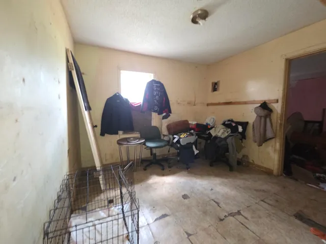 a living room with furniture and a mirror