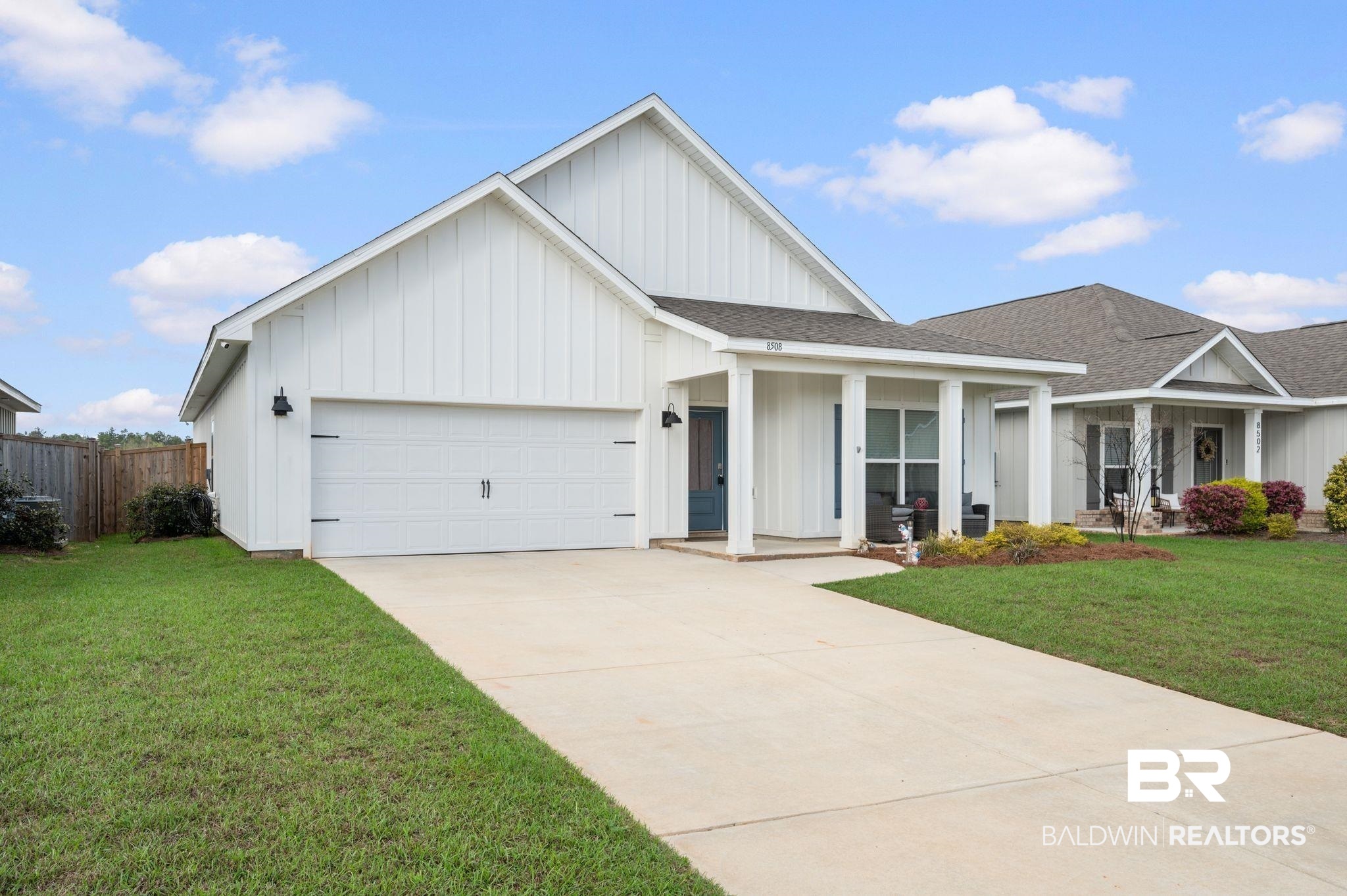 8508 Rosedown Lane Daphne, AL 36526 - Photo 2 of 29 View of front of property with board and batten siding, roof with shingles, and an attached garage