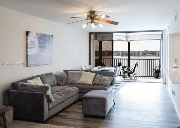 a living room with furniture and a large window