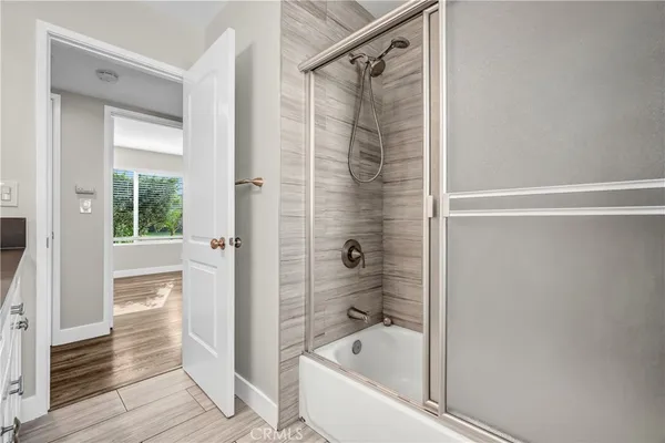 a kitchen with granite countertop a sink and cabinets