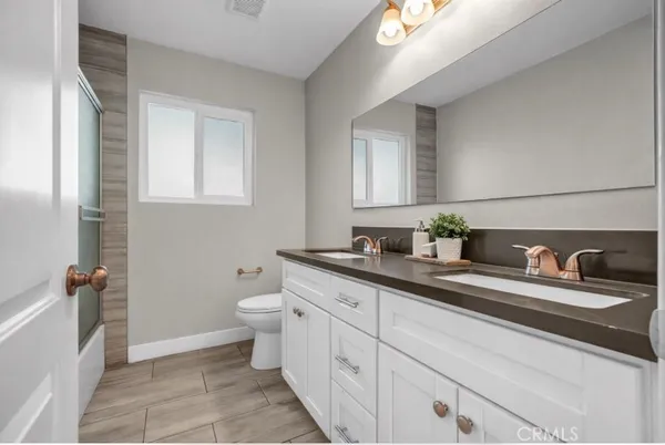 a bathroom with a bathtub and shower