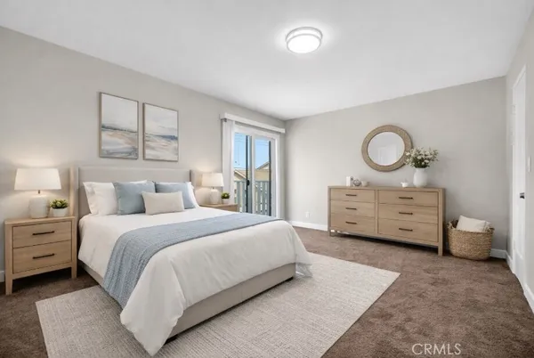 a view of an empty room with closet and a window