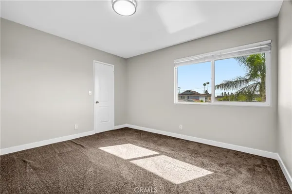 a view of a house with a yard and garage