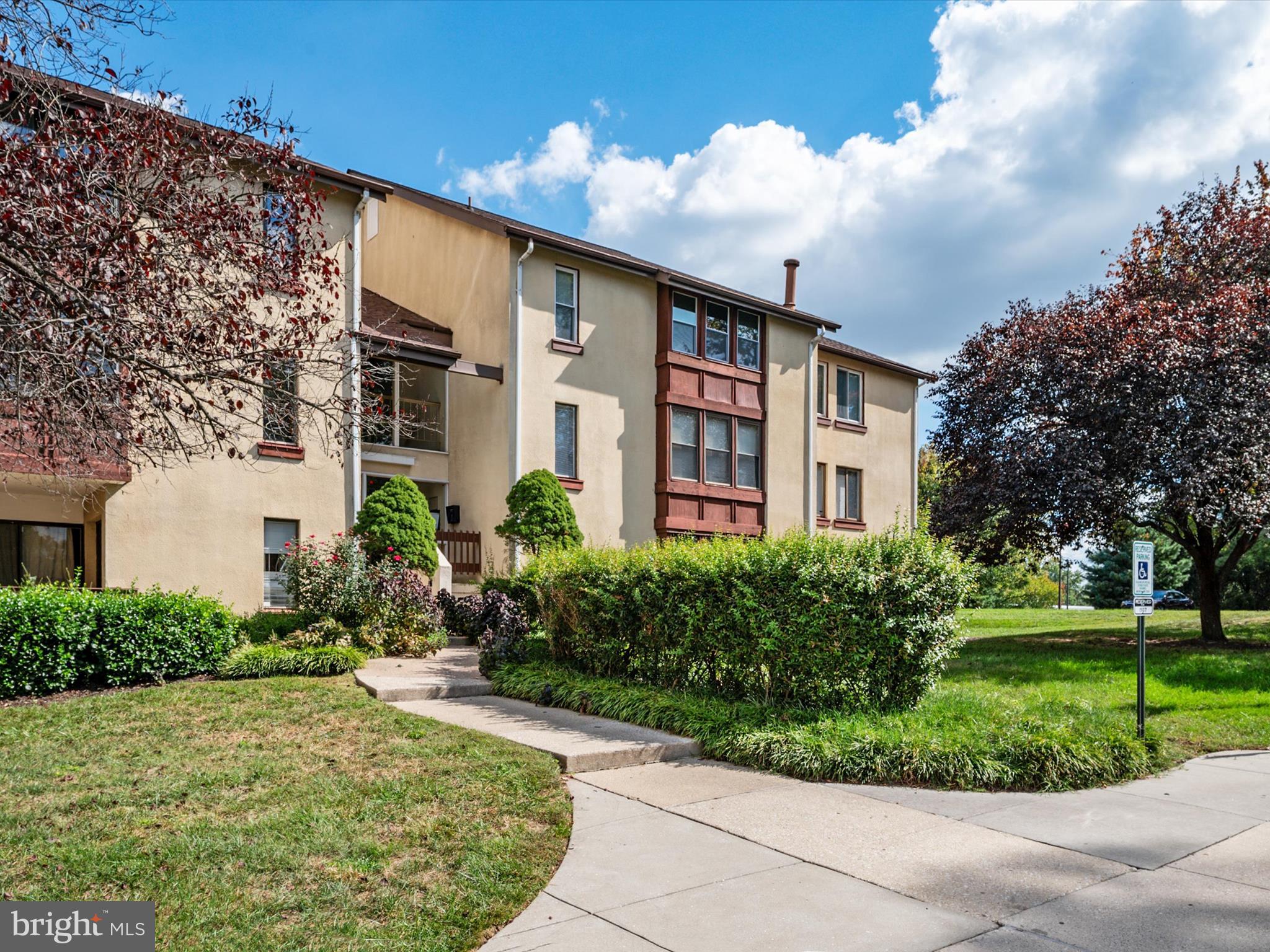 9639 White Acre Road, Unit B1 Columbia, MD 21045 - Photo 22 of 23 a front view of a house with garden
