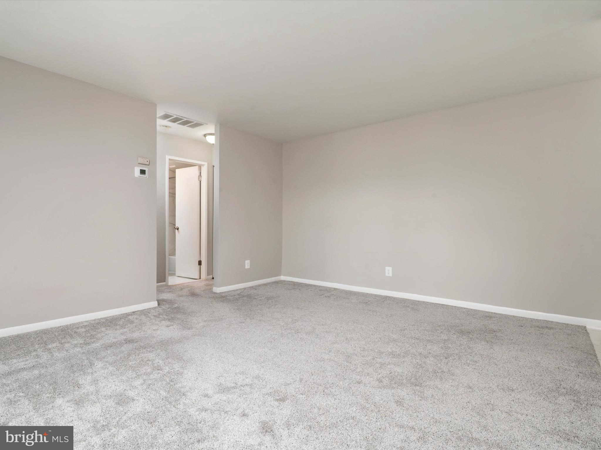 9639 White Acre Road, Unit B1 Columbia, MD 21045 - Photo 5 of 23 an empty room with an entryway