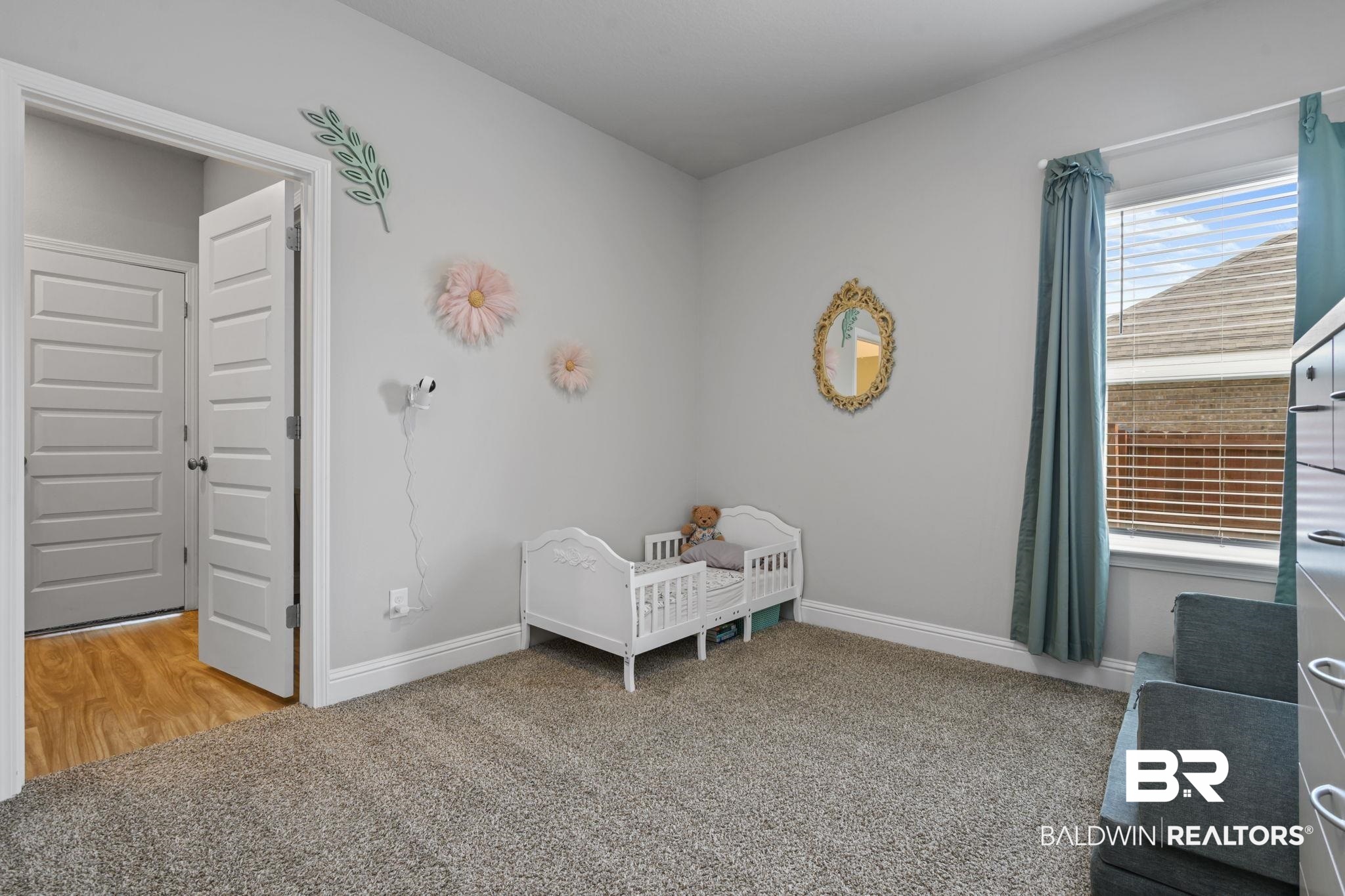 2183 Meadowview Loop Semmes, AL 36575 - Photo 21 of 58 Bedroom with light carpet and baseboards