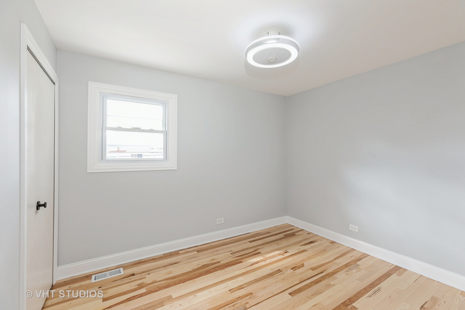 5657 Dover Road Oak Forest, IL 60452 - Photo 12 of 20 a view of empty room with wooden floor and fan