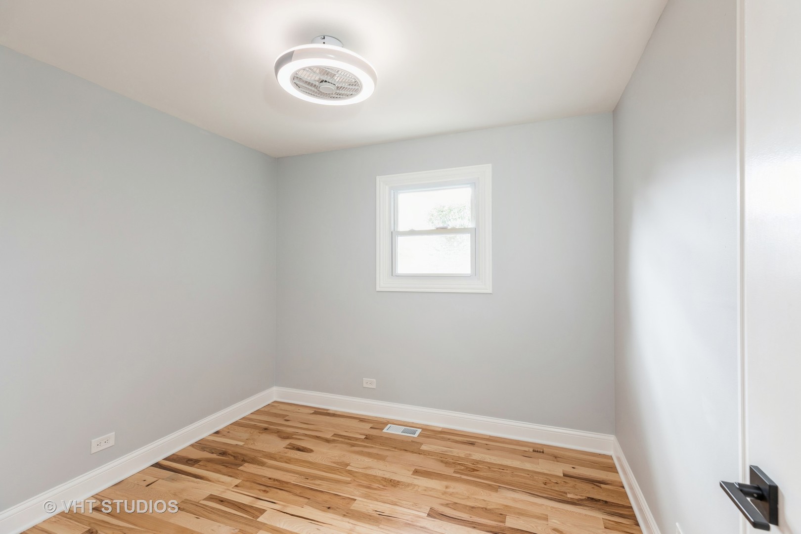 5657 Dover Road Oak Forest, IL 60452 - Photo 13 of 20 a view of a room with wooden floor and fan