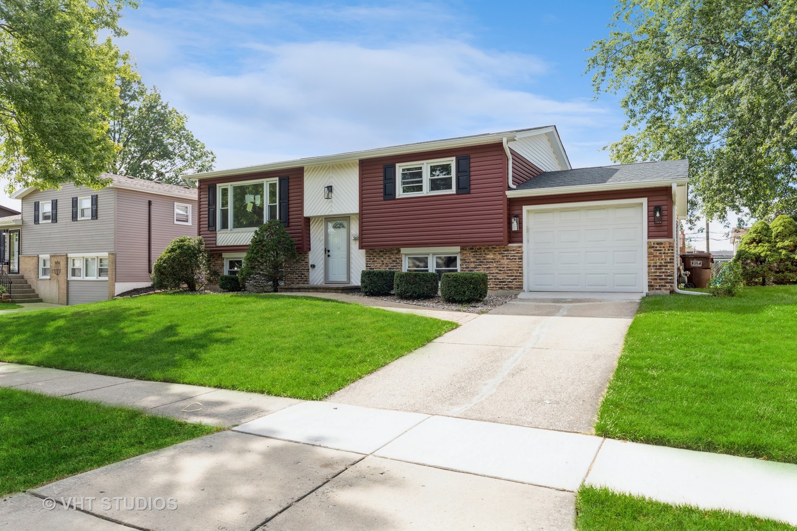 5657 Dover Road Oak Forest, IL 60452 - Photo 2 of 20 a front view of a house with a yard and garage