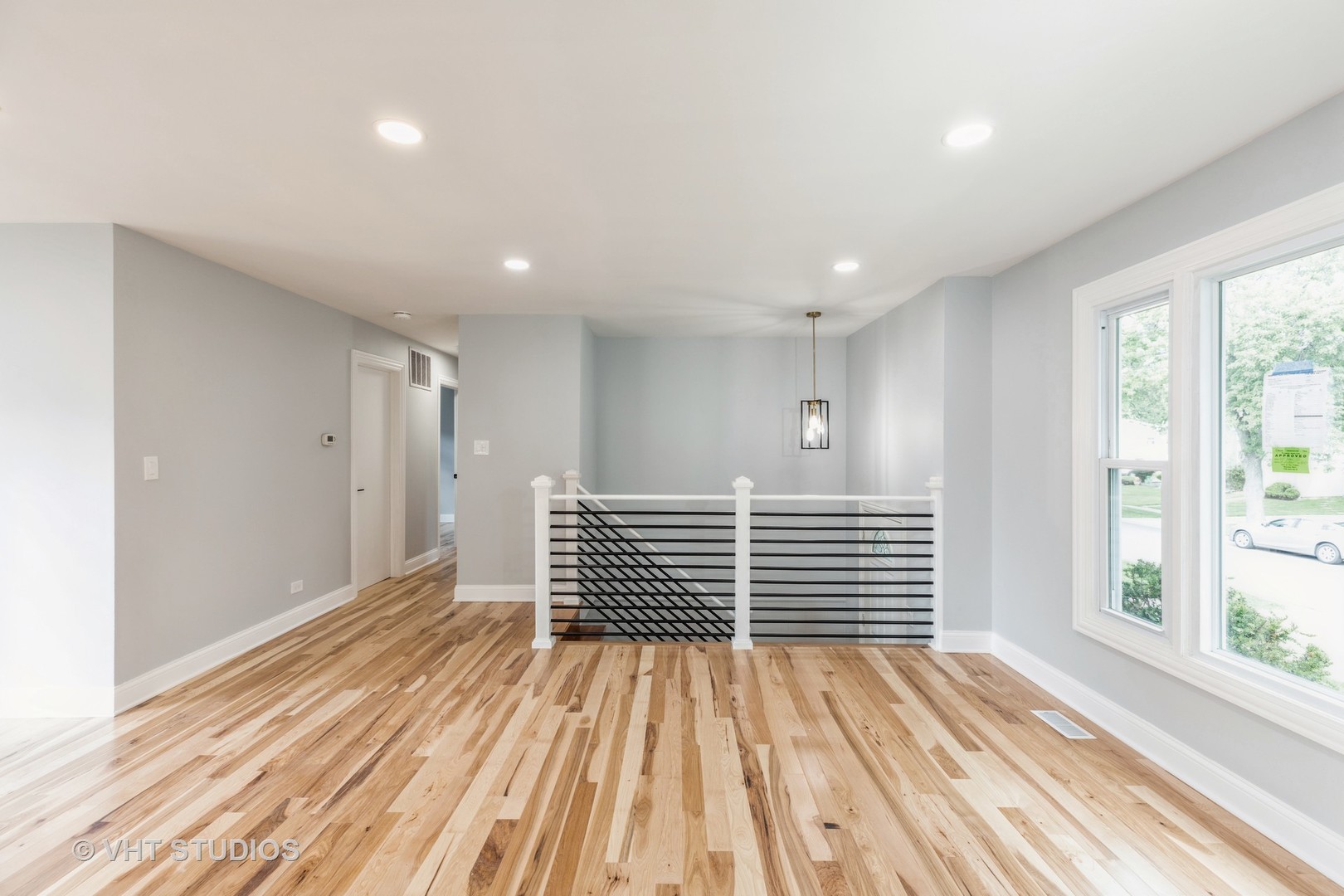 5657 Dover Road Oak Forest, IL 60452 - Photo 5 of 20 a view of wooden floor and windows in a room