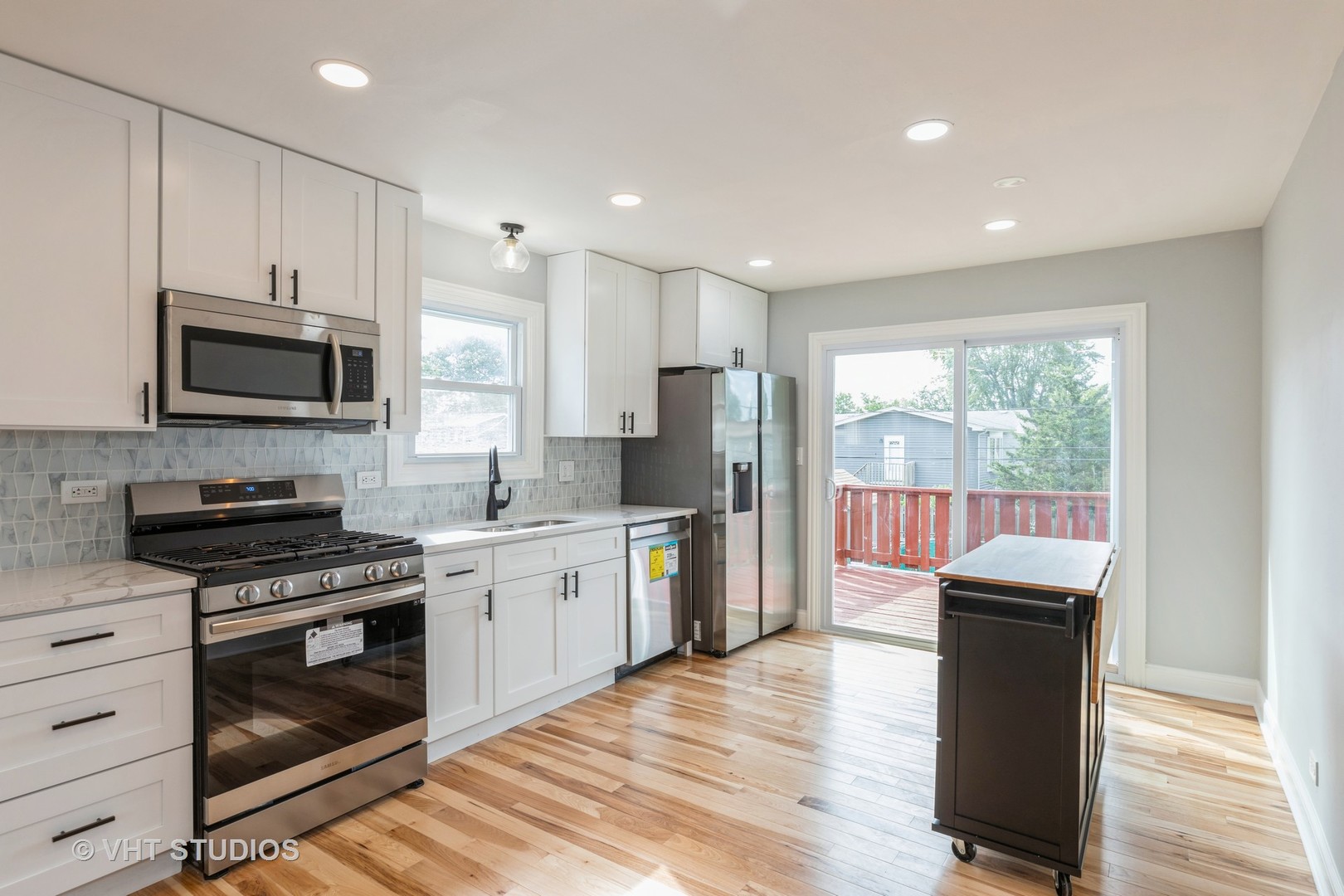 5657 Dover Road Oak Forest, IL 60452 - Photo 6 of 20 a kitchen with stainless steel appliances granite countertop a stove a sink and a microwave