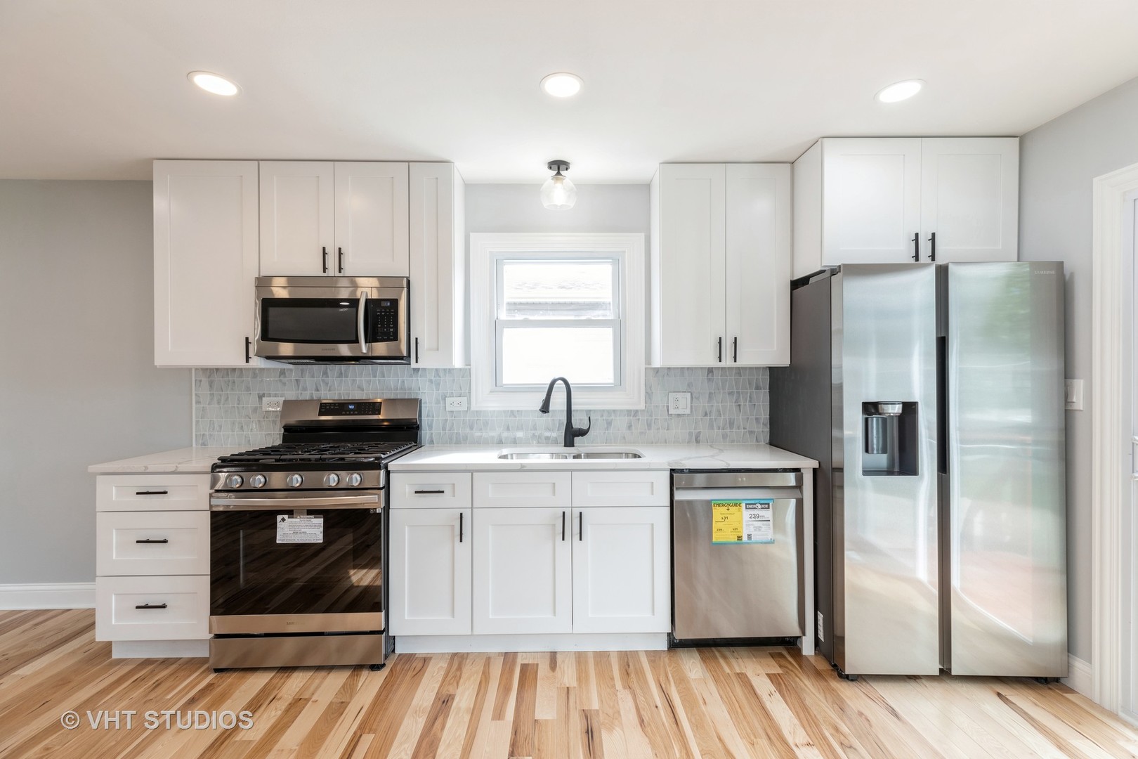 5657 Dover Road Oak Forest, IL 60452 - Photo 7 of 20 a kitchen with stainless steel appliances a stove a sink and a refrigerator