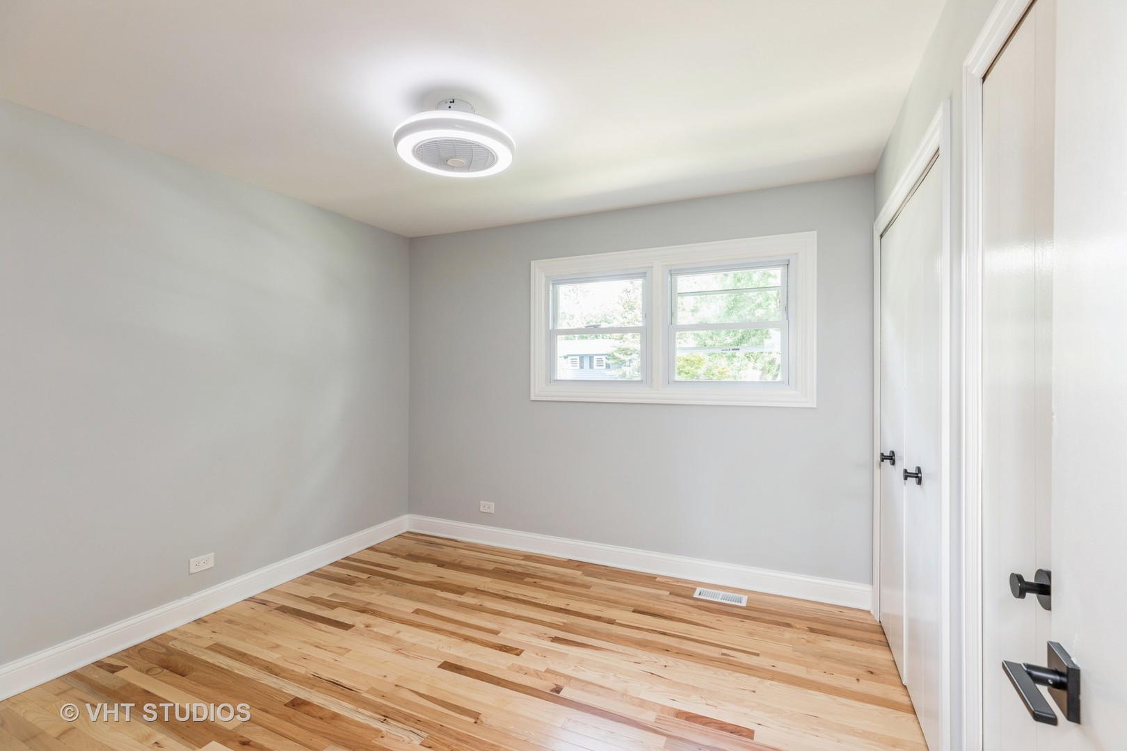 5657 Dover Road Oak Forest, IL 60452 - Photo 10 of 20 a view of a room with wooden floor and windows