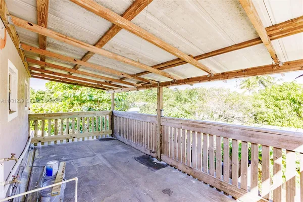 a view of porch with a swing