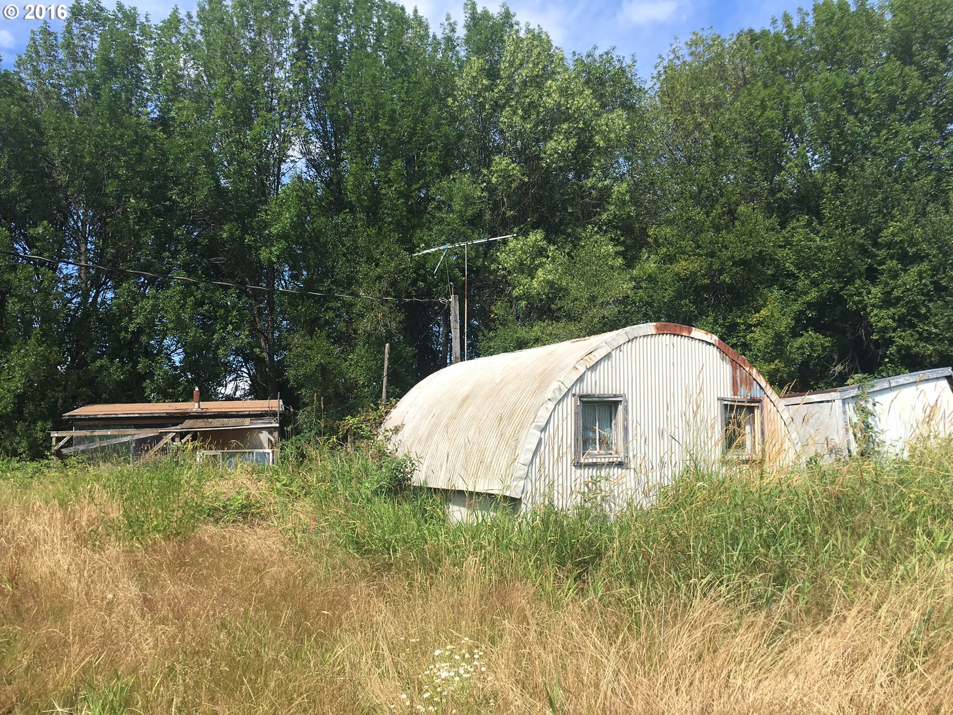 24514 Northwest Sauvie Island Road Portland, OR 97231 - Photo 12 of 16 a view of a backyard with swimming pool