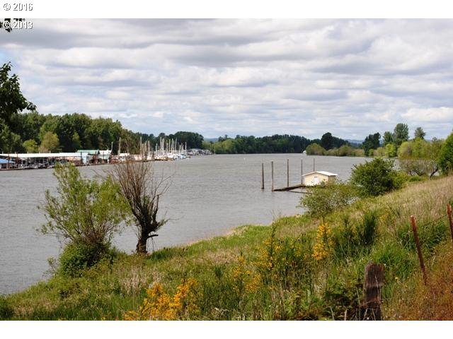 24514 Northwest Sauvie Island Road Portland, OR 97231 - Photo 3 of 16 a view of lake with houses in the back