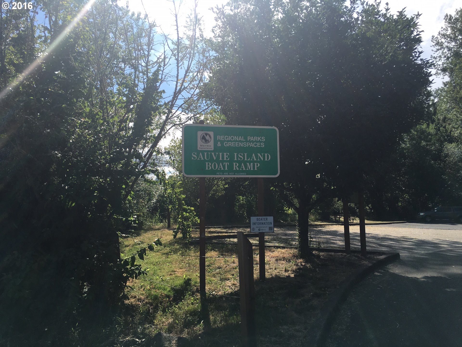 24514 Northwest Sauvie Island Road Portland, OR 97231 - Photo 9 of 16 a sign that is sitting in the middle of a yard