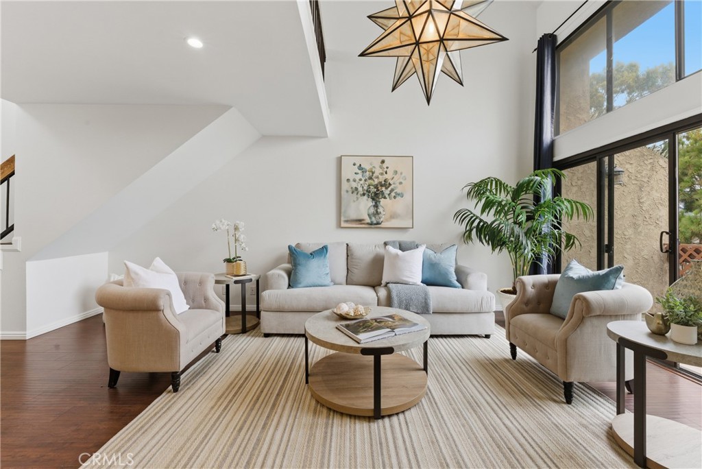 8180 Manitoba Street, Unit 330 Playa del Rey, CA 90293 - Photo 2 of 31 a living room with furniture and a large window