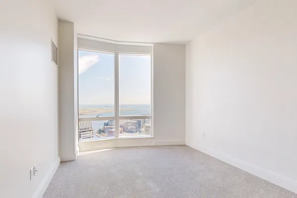 a view of an empty room and a window