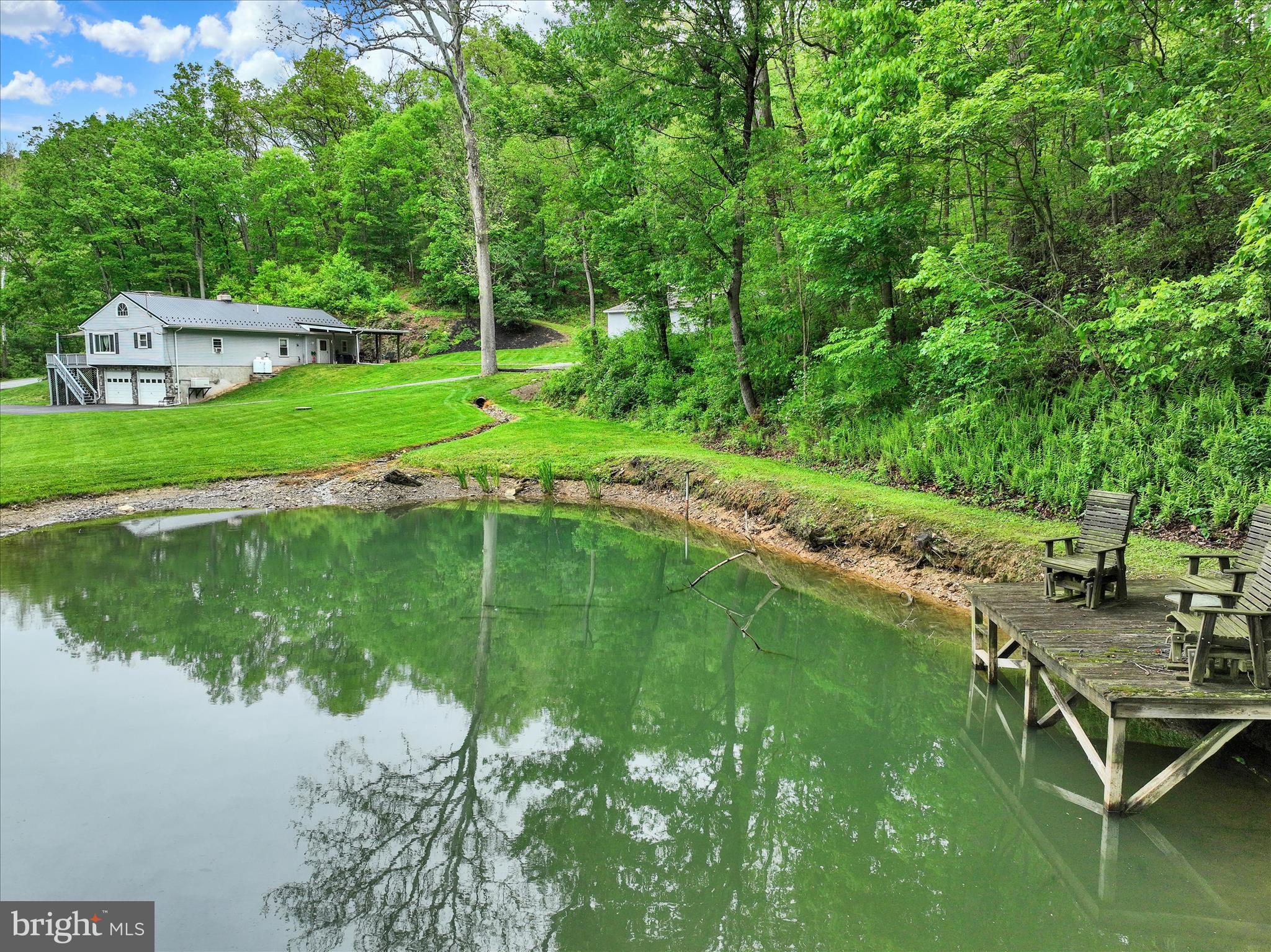 13127 Manor Furnace Road Brogue, PA 17309 - Photo 13 of 78 a view of a lake with a yard and large trees