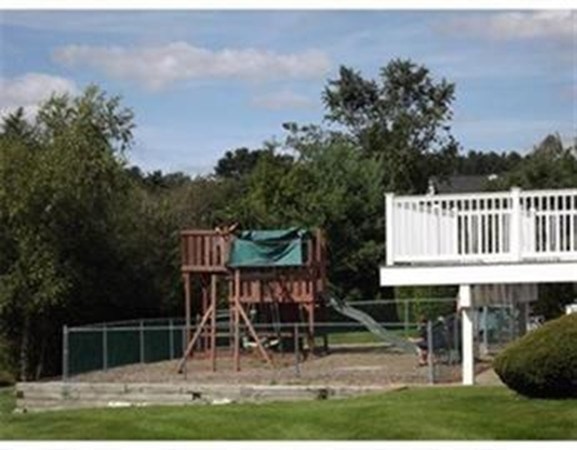 33 Christopher Drive, Unit A Stoughton, MA 02072 - Photo 21 of 23 a view of a chair and table in the yard