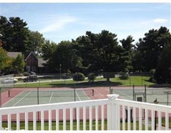 33 Christopher Drive, Unit A Stoughton, MA 02072 - Photo 22 of 23 a view of a tennis court with sitting area and garden