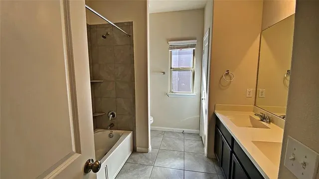 a bathroom with a double vanity sink and mirror