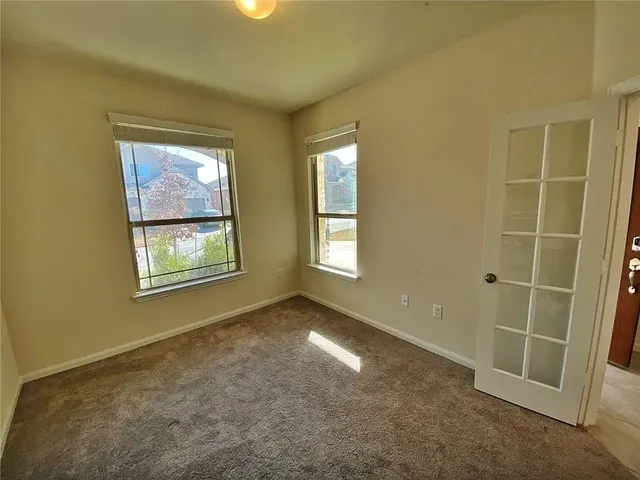 an empty room with windows